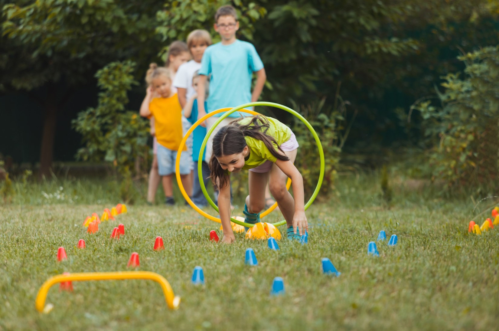 children playing safely in the grass